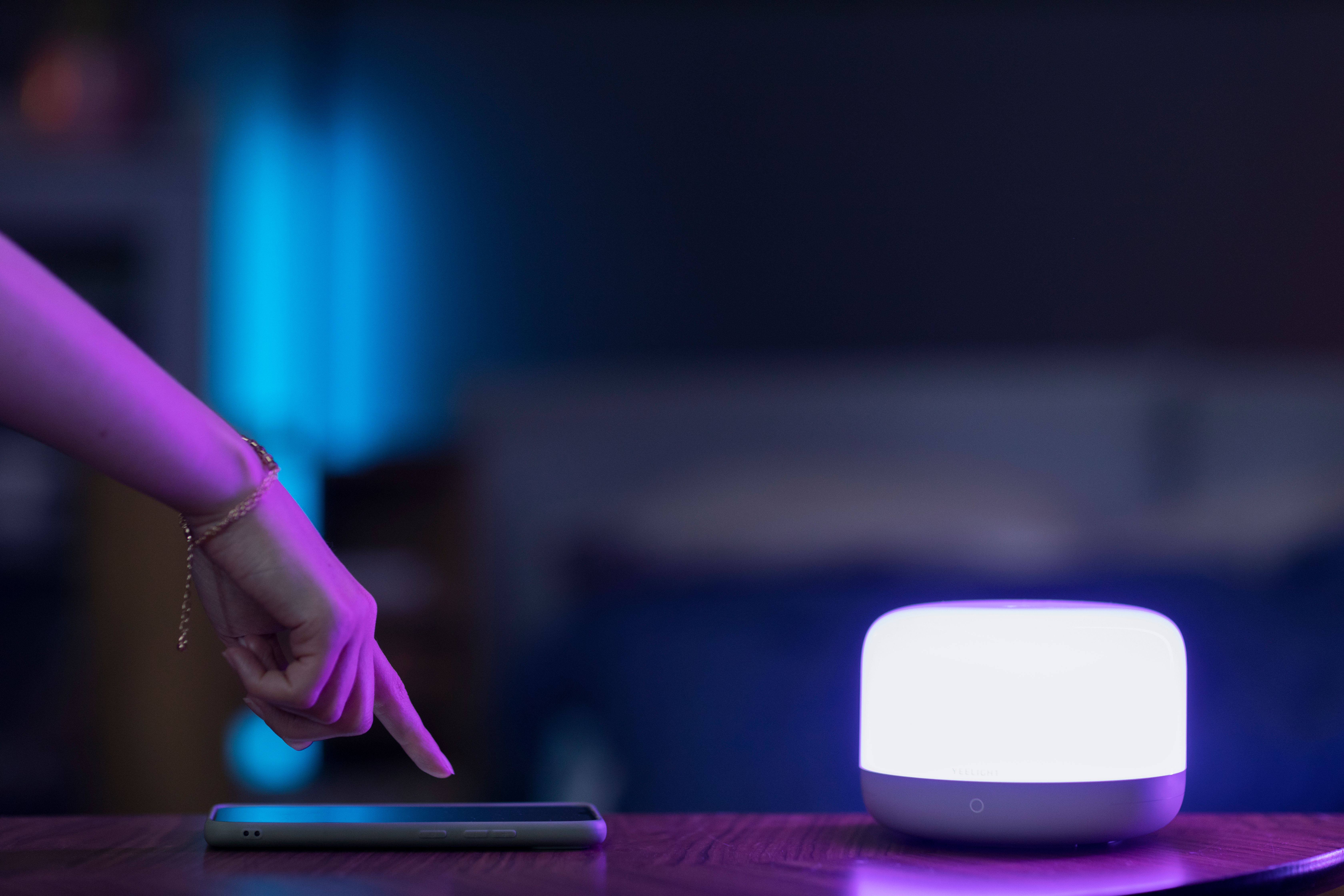 side-view-hand-with-smartphone-smart-light