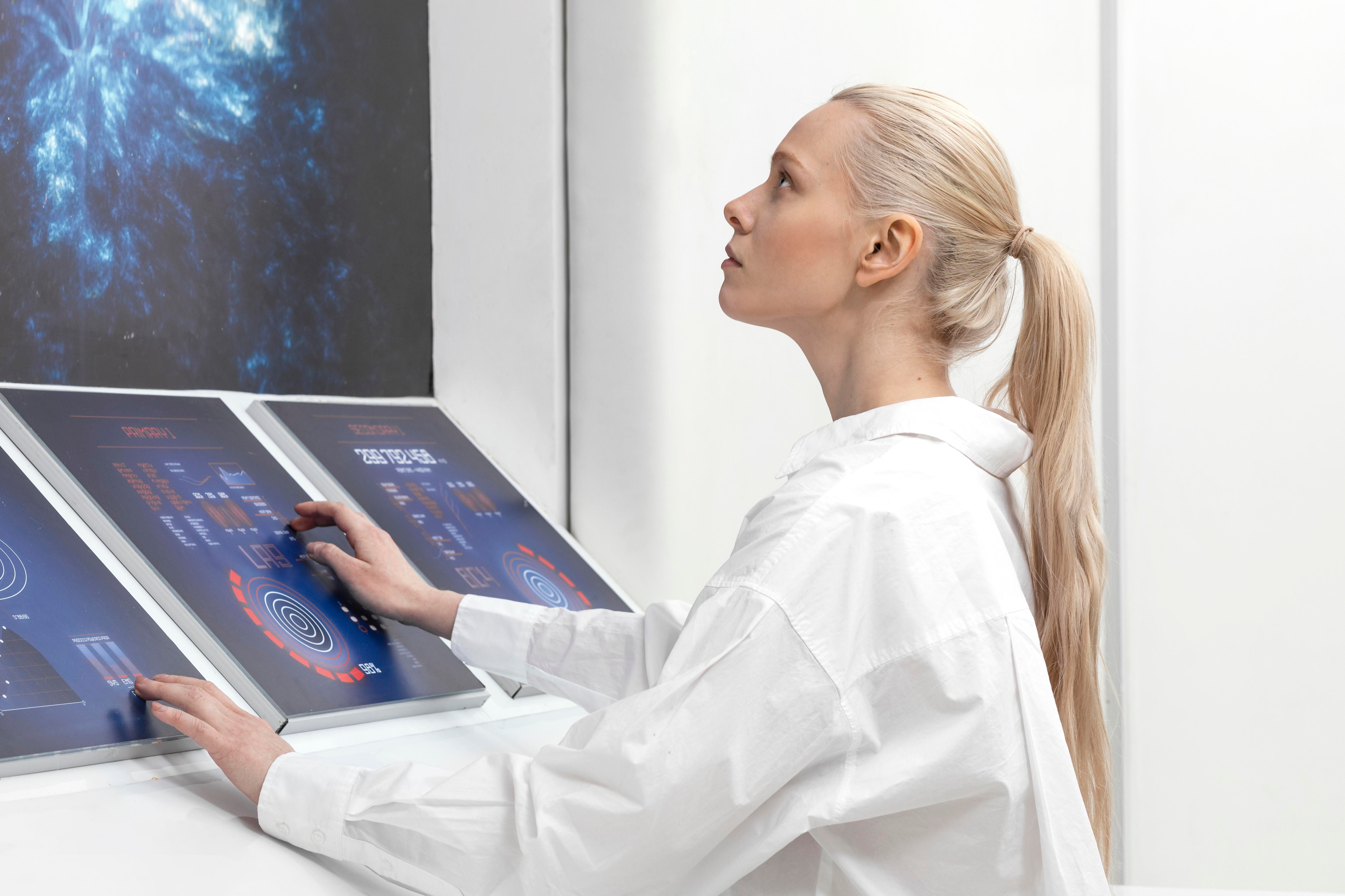 side-view-woman-working-digital-monitors